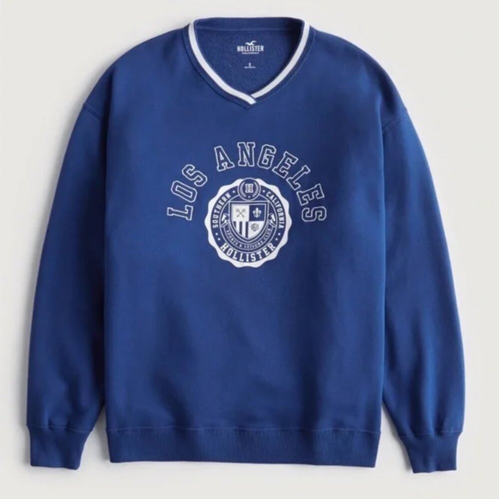 Hollister: Oversized Blue and White Varsity Vneck Los Angeles Sweatshirt